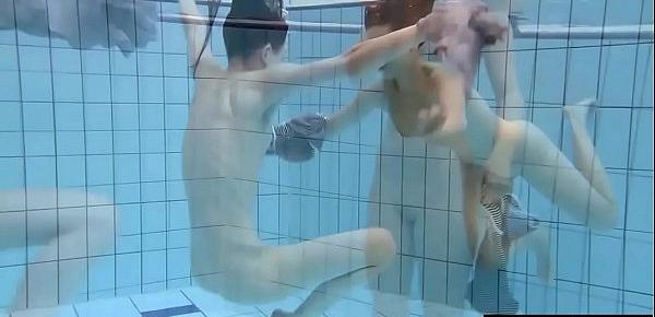  Shaved brunette with big tits underwater